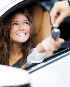 Happy woman receiving car key